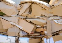 Huge pile of cardboard boxes at a business waiting for shipping container removal services in Los Angeles, CA to pick them up.